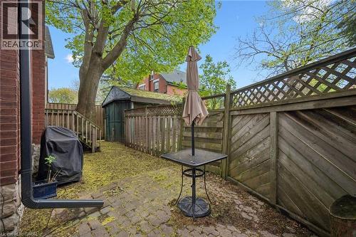 Brick exterior with a paved patio area - 15 Gordon Avenue, Kitchener, ON - Outdoor