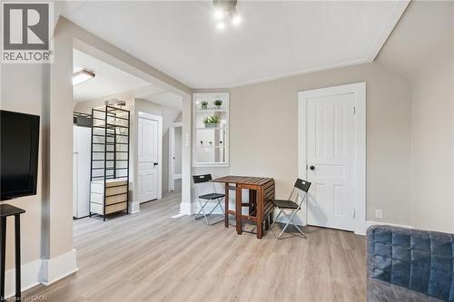 Spacious room with wood-finish flooring, light-toned walls, and recessed lighting - 15 Gordon Avenue, Kitchener, ON - Indoor Photo Showing Other Room