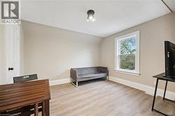 Light-toned wood-finish flooring complements neutral wall tones - 