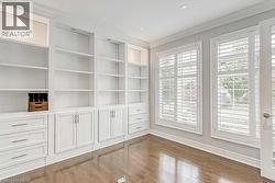 Built-in white cabinetry with integrated shelving and drawers - 