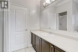 White vanity with a laminate countertop, undermount sink, and chrome faucet - 