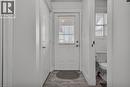 Entryway featuring wood-finish flooring, a paneled door with integrated blinds, and painted trim - 425 Erinbrook Drive, Kitchener, ON  - Indoor Photo Showing Other Room 