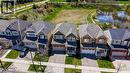 Two-story residence featuring a two-car garage, front porch, and dormer windows - 19 Shoreacres Drive, Kitchener, ON  - Outdoor With Facade 