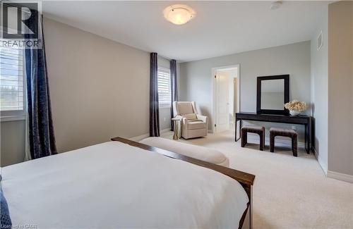 Bright room with light-toned wall paint and plush carpeting - 19 Shoreacres Drive, Kitchener, ON - Indoor Photo Showing Bedroom