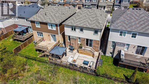 Two-story residence featuring a wood deck with a built-in pergola structure - 19 Shoreacres Drive, Kitchener, ON - Outdoor