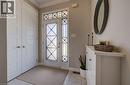 Entryway featuring tiled flooring, a decorative glass front door with sidelight and transom, and a built-in storage cabinet - 19 Shoreacres Drive, Kitchener, ON  - Indoor Photo Showing Other Room 