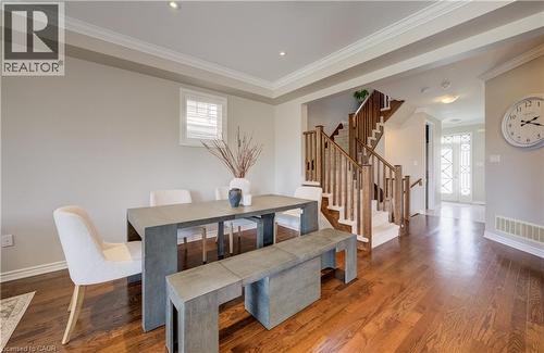 Hardwood-style flooring throughout the main level - 19 Shoreacres Drive, Kitchener, ON - Indoor Photo Showing Dining Room