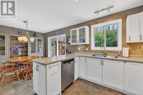 23 Mcfadden Drive, Springwater, ON - Indoor Photo Showing Kitchen With Double Sink