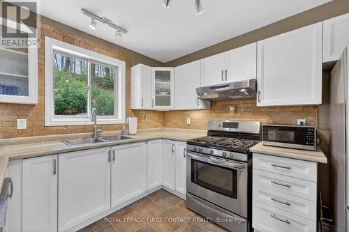 23 Mcfadden Drive, Springwater, ON - Indoor Photo Showing Kitchen With Double Sink
