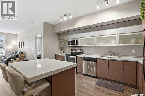 102 225 Maningas Bend, Saskatoon, SK - Indoor Photo Showing Kitchen With Stainless Steel Kitchen With Double Sink
