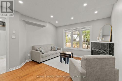 40 Milner Downs Crescent, Ottawa, ON - Indoor Photo Showing Living Room With Fireplace