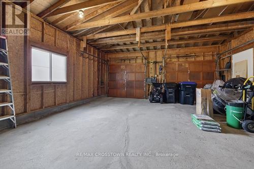 Double garage - 50 Withall Grove, Tiny, ON - Indoor Photo Showing Garage