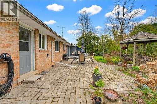 Brick exterior featuring a paver patio with a separate gazebo structure - 10 Huisman Lane, Hamilton, ON - Outdoor