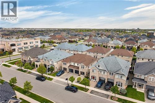 Aerial perspective showcasing a residential neighborhood with numerous detached homes - 4236 Prudham Avenue, Burlington, ON - Outdoor With View