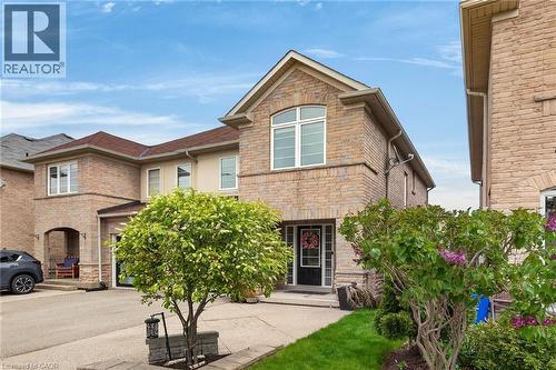 Stone and brick facade with an arched entrance - 4236 Prudham Avenue, Burlington, ON - Outdoor