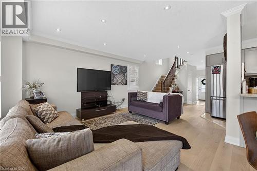 Open-concept living area with light wood-finish flooring, recessed lighting, and crown molding - 4236 Prudham Avenue, Burlington, ON - Indoor Photo Showing Living Room