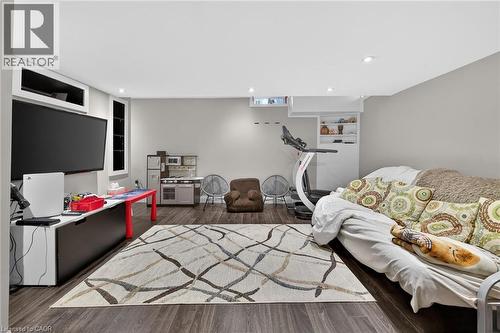 Finished lower-level space featuring recessed lighting and wood-finish flooring - 4236 Prudham Avenue, Burlington, ON - Indoor