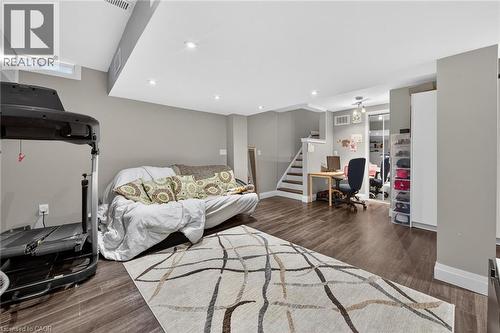 Open-concept room featuring wood-finish flooring, recessed lighting, and a neutral wall palette - 4236 Prudham Avenue, Burlington, ON - Indoor