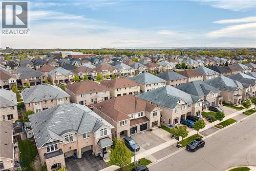 Expansive aerial perspective showcasing a residential street lined with contemporary homes - 4236 Prudham Avenue, Burlington, ON - Outdoor With View