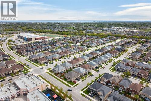 Expansive aerial perspective showcasing a residential development with numerous detached homes - 4236 Prudham Avenue, Burlington, ON - Outdoor With View