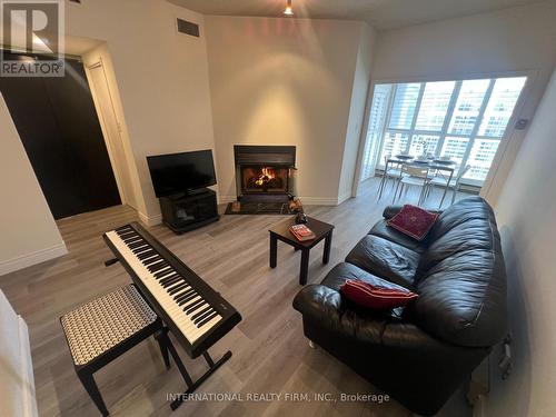 Living Room - Ph5 - 65 Scadding Avenue, Toronto, ON - Indoor Photo Showing Living Room With Fireplace
