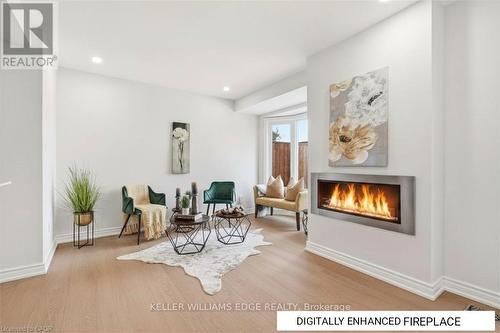Family Room w/ Digitally Enhanced Fireplace - 14 Harbour Drive, Hamilton, ON - Indoor Photo Showing Living Room With Fireplace