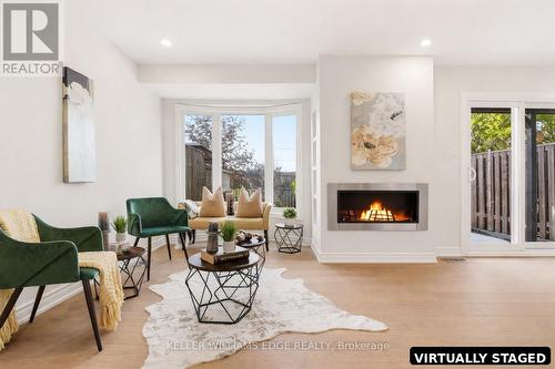Family Room w/ Digitally Enhanced Fireplace - 14 Harbour Drive, Hamilton, ON - Indoor Photo Showing Living Room With Fireplace