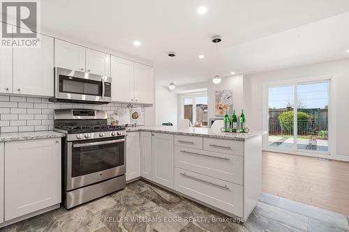 Kitchen w/ Stainless Steel Appliances - 14 Harbour Drive, Hamilton, ON - Indoor Photo Showing Kitchen With Upgraded Kitchen