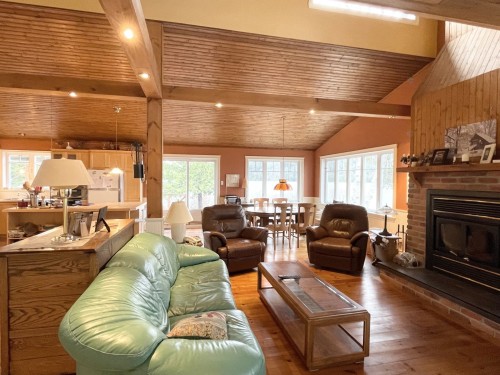 Vue d'ensemble - 699 Ch. Du Lac-Des-Cornes, Chute-Saint-Philippe, QC - Indoor Photo Showing Living Room With Fireplace