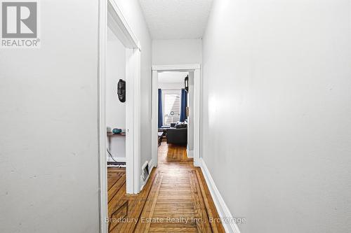 Hallway and Main Level with Inlaid Hardwood - 43 Harvey Street, Hamilton (Gibson), ON - Indoor Photo Showing Other Room
