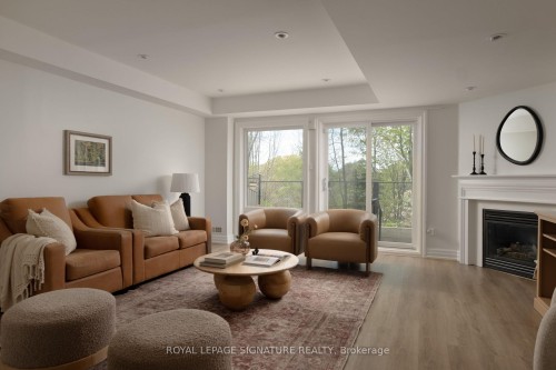 98 Dallimore Circle, Toronto, ON - Indoor Photo Showing Living Room With Fireplace