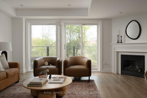98 Dallimore Circle, Toronto, ON - Indoor Photo Showing Living Room With Fireplace