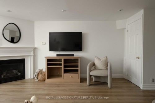 98 Dallimore Circle, Toronto, ON - Indoor Photo Showing Living Room With Fireplace