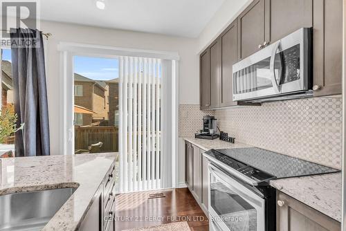 458 Etheridge Avenue, Milton, ON - Indoor Photo Showing Kitchen With Upgraded Kitchen