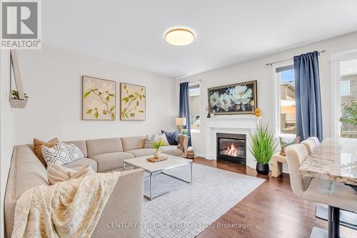 458 Etheridge Avenue, Milton, ON - Indoor Photo Showing Living Room With Fireplace