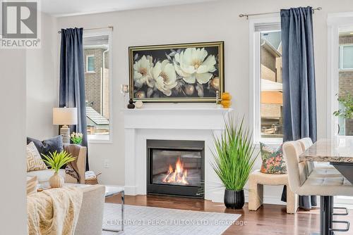 458 Etheridge Avenue, Milton, ON - Indoor Photo Showing Living Room With Fireplace