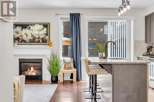 458 Etheridge Avenue, Milton, ON - Indoor Photo Showing Kitchen With Fireplace With Upgraded Kitchen