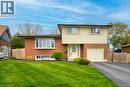 Brick and siding exterior featuring a curved bay window - 34 Westwood Crescent, Kitchener, ON  - Outdoor 