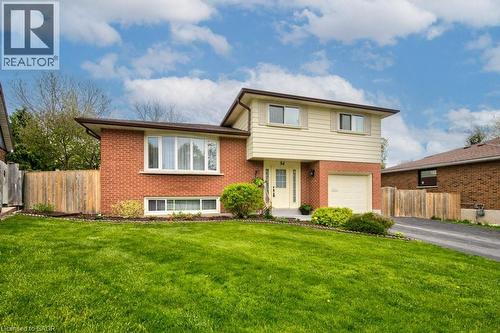 Split-level residence featuring a brick facade and light-colored siding - 34 Westwood Crescent, Kitchener, ON - Outdoor