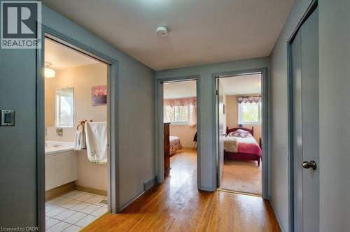 Hardwood-finish flooring throughout the hallway - 34 Westwood Crescent, Kitchener, ON - Indoor Photo Showing Other Room