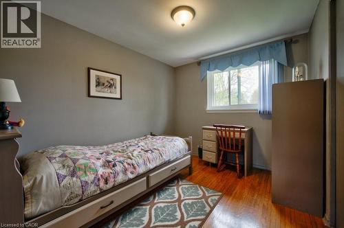 Bedroom featuring wood-finish flooring, a double window, and neutral wall tones - 34 Westwood Crescent, Kitchener, ON - Indoor Photo Showing Bedroom