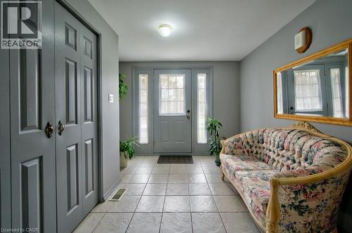 Entryway featuring light grey walls and light-toned square tile flooring - 34 Westwood Crescent, Kitchener, ON - Indoor Photo Showing Other Room