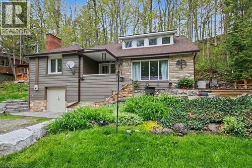 Stone and siding exterior with a prominent brick chimney - 1333 Hidden Valley Road, Burlington, ON - Outdoor