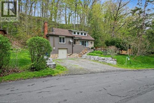 Split-level home featuring a stone facade and siding exterior - 1333 Hidden Valley Road, Burlington, ON - Outdoor