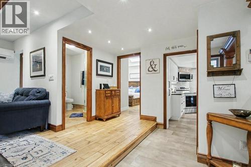Hardwood-finish flooring and recessed lighting throughout, complemented by warm wood trim and solid core doors - 1333 Hidden Valley Road, Burlington, ON - Indoor
