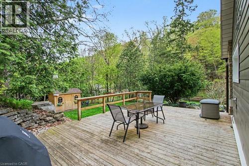 Expansive wood-plank deck with a wooden railing, surrounded by mature trees - 1333 Hidden Valley Road, Burlington, ON - Outdoor With Deck Patio Veranda