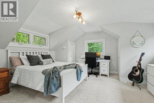Bright bedroom with dormer ceilings and carpeting - 1333 Hidden Valley Road, Burlington, ON - Indoor Photo Showing Bedroom