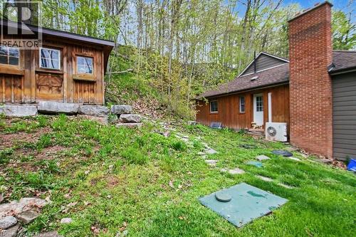Wood-sided outbuilding with two windows and a wood door - 1333 Hidden Valley Road, Burlington, ON - Outdoor