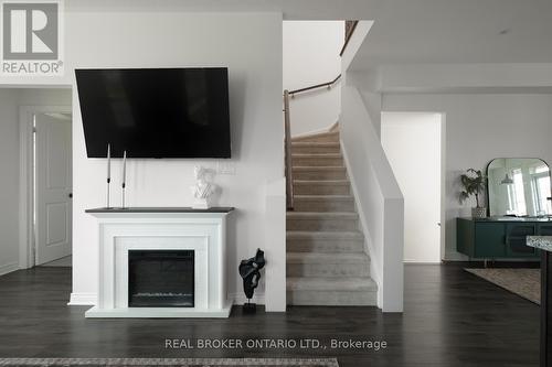 Stairs to second storey - 2 Mcdevitt Lane, Caledon, ON - Indoor Photo Showing Living Room With Fireplace
