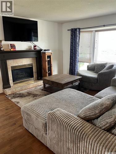 404 Petterson Drive, Estevan, SK - Indoor Photo Showing Living Room With Fireplace